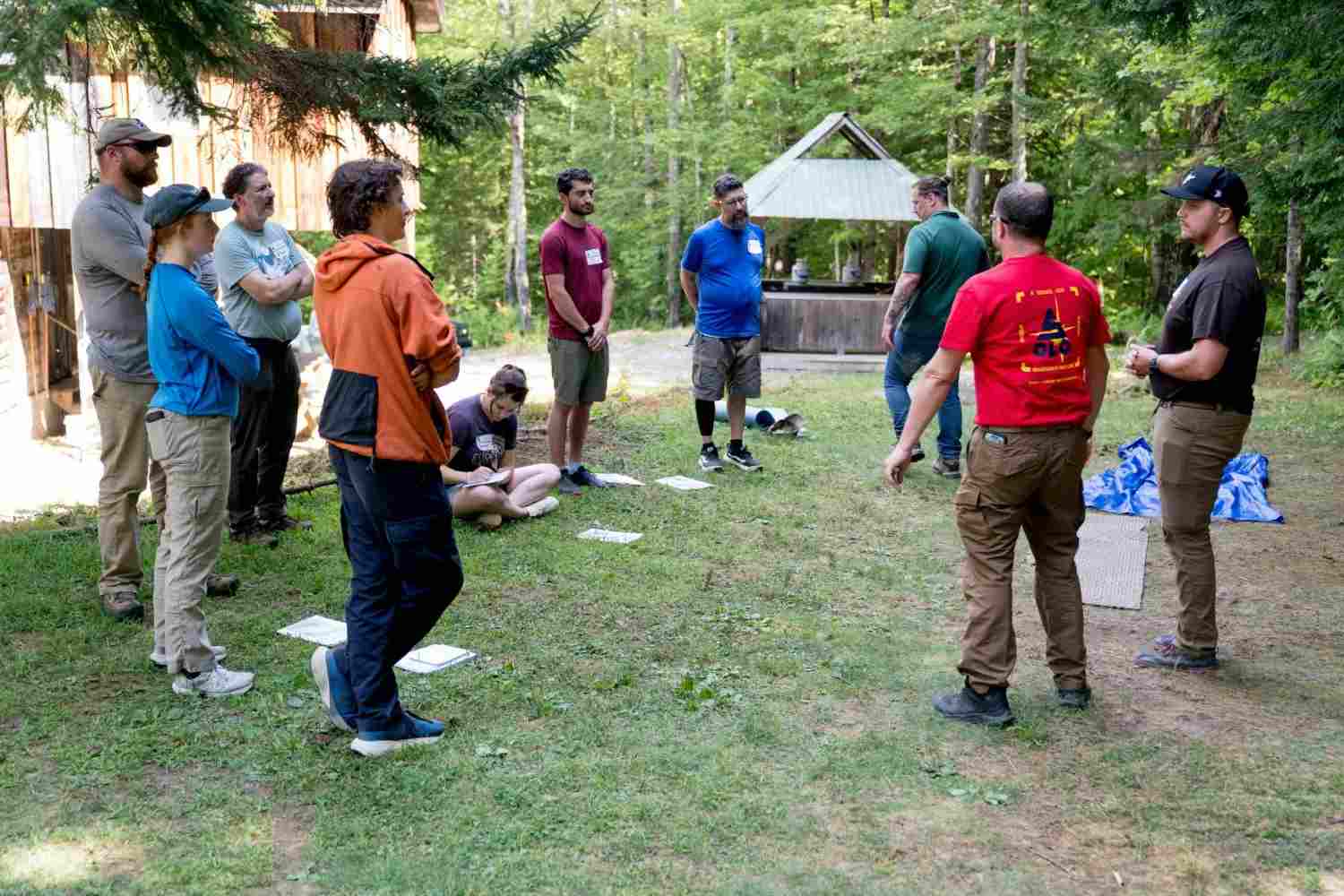 Group of people gathered in a circle outdoors